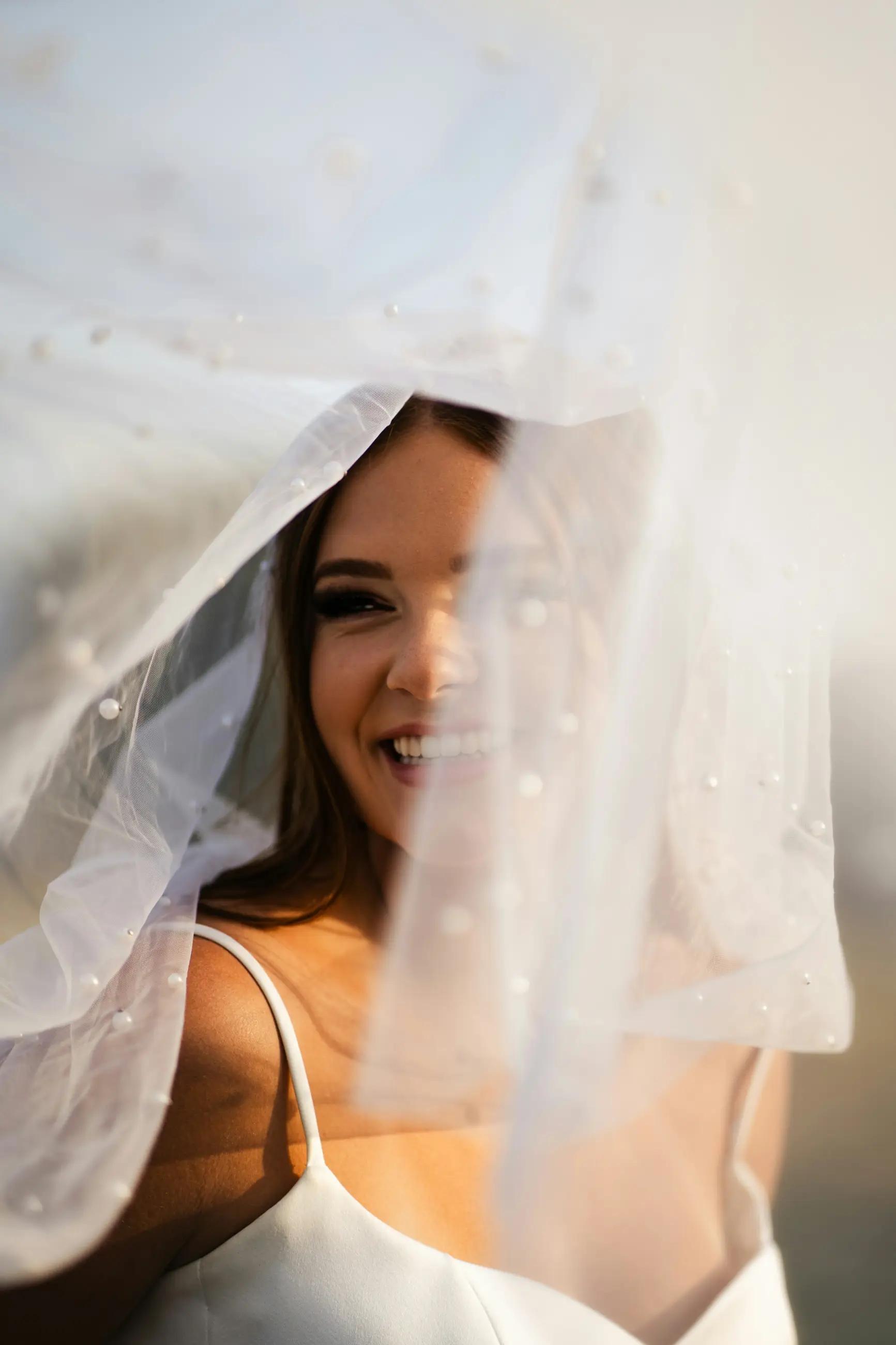 Model wearing a white gown